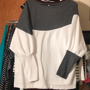 Woman’s dual colored dolman off the shoulder top